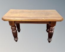 A Victorian oak side table adapted from a dining table.
