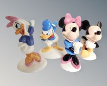 Four Royal Doulton Mickey Mouse collection Disney figures including Donald Duck, Daisy Duck,