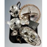 A tray of hammered pewter four piece tea set, photograph frame, tea strainer,