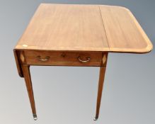 An Edwardian mahogany and satinwood inlaid pembroke table fitted with a drawer.
