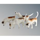 Four Beswick beagles.