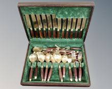 A canteen of brass cutlery