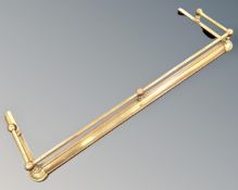 A brass fire curb (width 134cm)