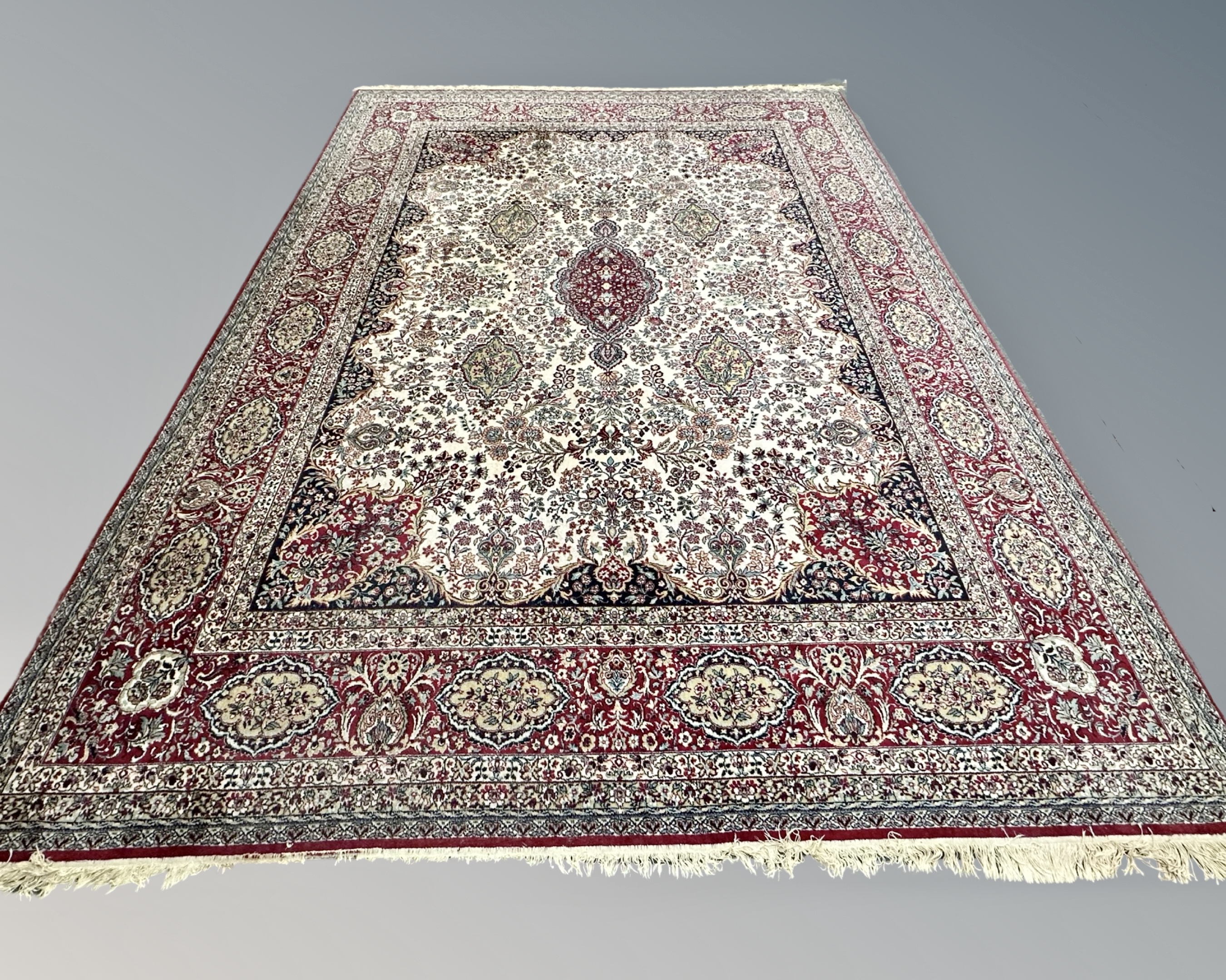 A machined carpet of Persian design, 302cm by 405cm.