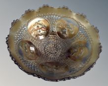 A scarce American Fenton carnival amethyst glass horse head medallion three footed bowl,