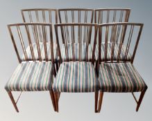 A set of six continental dining chairs in striped upholstery.