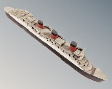 A hand-built wooden model of a ship.