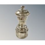 A silver pepper mill, David Shaw Silverware Ltd, London 1980, height 11cm.