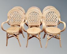A set of six wicker armchairs.