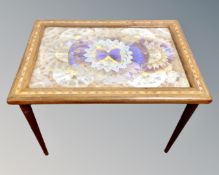 A satinwood inlaid butterfly wing table.