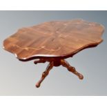 An Italian style shaped coffee table on quatrefoil base together with a lamp table in the form of a