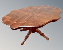 An Italian style shaped coffee table on quatrefoil base together with a lamp table in the form of a