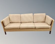 A late 20th century Scandinavian settee upholstered in oatmeal fabric, length 213 cm.
