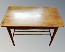 A Scandinavian teak low table with undershelf.