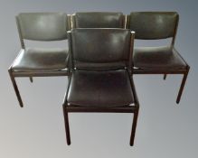 A set of four late 20th century continental dining chairs in brown vinyl upholstery.