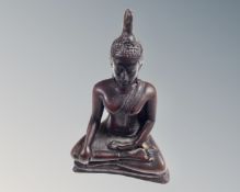 A carved horn figure of Buddha, height 11 cm.
