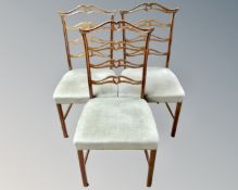 A set of three mahogany dining chairs.