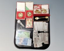 A tray containing bank notes, cufflinks, Chinese medallions, collector's spoons etc.