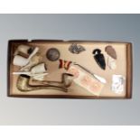 A tray containing an enamelled butterfly brooch, Victorian 1889 silver crown, pipes, arrowheads,