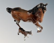 A Beswick cantering horse, brown gloss, together with a foal.