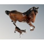 A Beswick cantering horse, brown gloss, together with a foal.