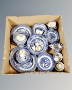 A box of blue and white old Willow pattern china