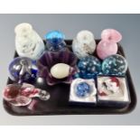 A tray of glass paperweights and mottled glass vases