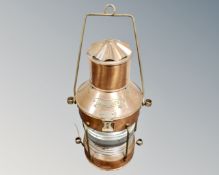 An Ankerlicht copper ship's lamp, fitted with a bulb.