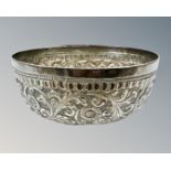 An Indian silver dish, with floral embossed detail, diameter 6.75cm.