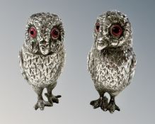 A pair of Victorian novelty silver salt and pepper sifters in the form of owls,