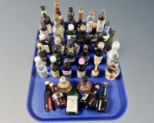 A tray containing a large quantity of alcohol miniatures.