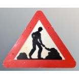 An enamelled metal roadworks sign.