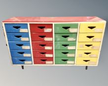 A 20th century painted twenty drawer chest,