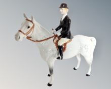 A Beswick huntswoman on grey horse no.1730. CONDITION REPORT: Good condition.