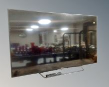 A Sony Bravia 54 inch LCD TV with remote together with a Sony HT-CT 180 sound bar