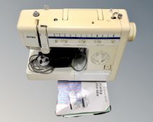 A Jones electric sewing machine with plug and foot pedal