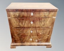 A 19th century continental mahogany chest of four drawers.