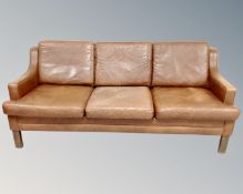 A 20th century Scandinavian brown leather three seater settee (length 185 cm)