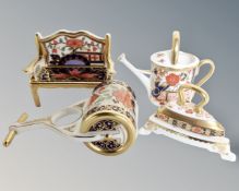 A group of four Royal Crown Derby Imari cabinet pieces comprising of watering can, bench,
