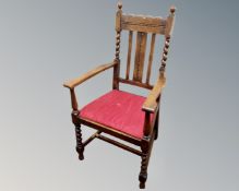 A 1920s office chair with barleytwist supports.