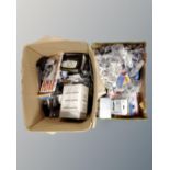 Two boxes of assorted cables and chargers, iPod cases,
