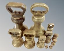 Eleven various graduated brass weights