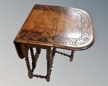 A 19th century carved oak barleytwist gateleg table.