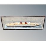 A scale model of the Mauritania in triangular glazed display case,