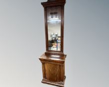 A 19th century flame mahogany bow fronted side cabinet with mirror above.