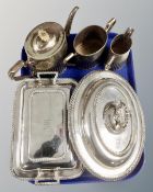 A group of silver plated wares including two lidded entree dishes