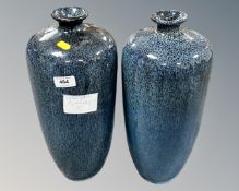 A pair of Cornish pottery blue glazed baluster vases.