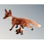 A Beswick fox, length 24cm, together with a seated Beswick fox.