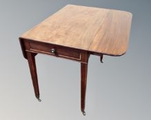 A Victorian mahogany Pembroke table fitted with a drawer.