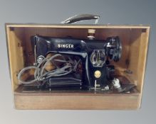 A Singer model 201K electric sewing machine with foot pedal in carry case